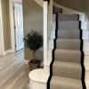 Flatweave Herringbone Carpet in Dapple on stairs in neutral hallway